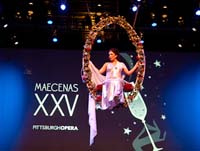 Pittsburgh Opera Resident Artist Danielle Pastin serenades Maecenas guests from above the stage